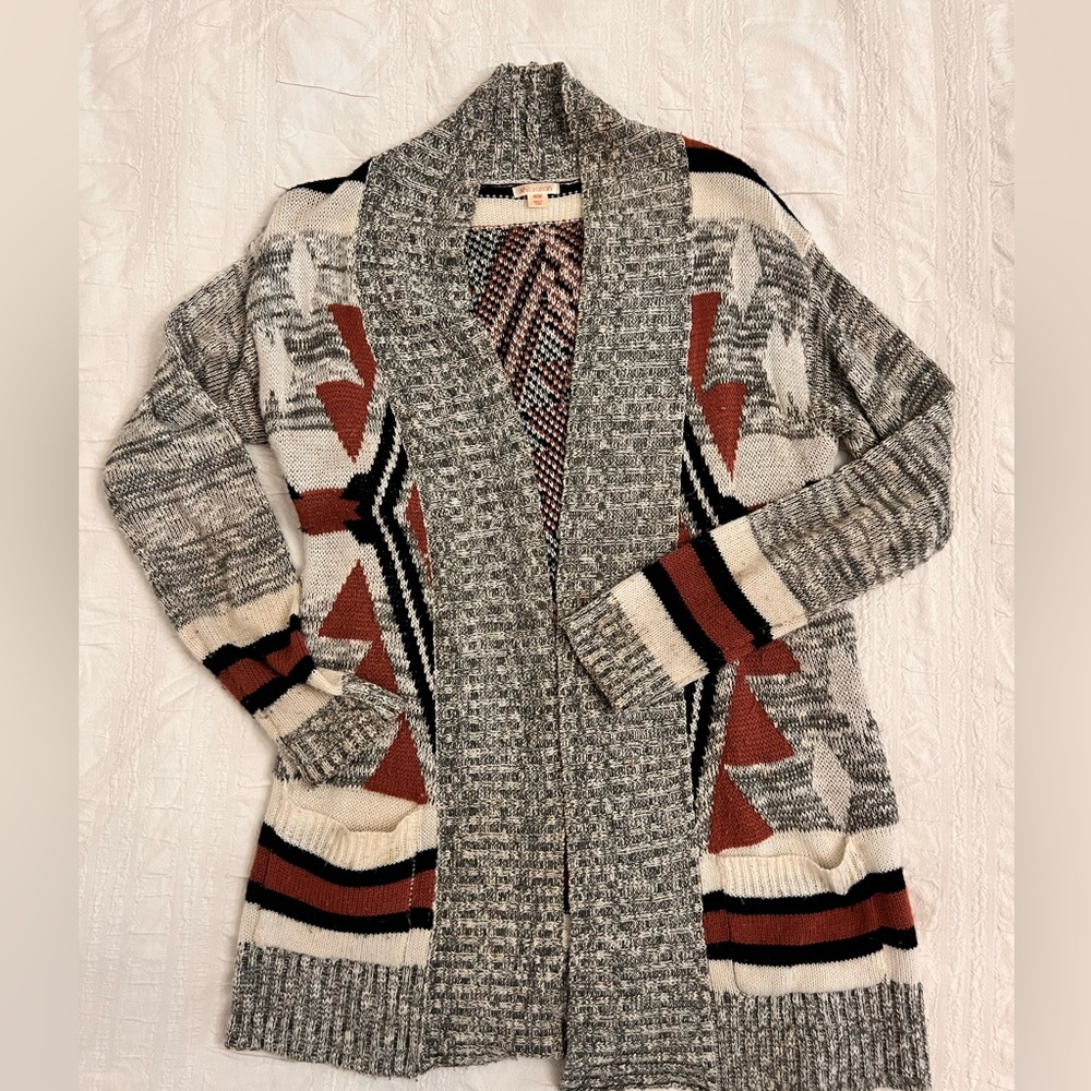 Geometric patterned cardigan sweater size M.